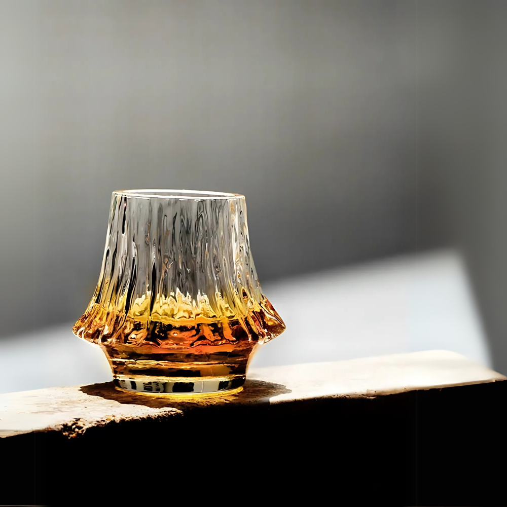 Fuji whiskey glass filled with Toki Japanese whiskey on a wooden surface