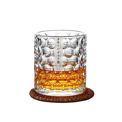 Elegant Japanese glassware - Kyoto Pour whiskey glass on a woven coaster