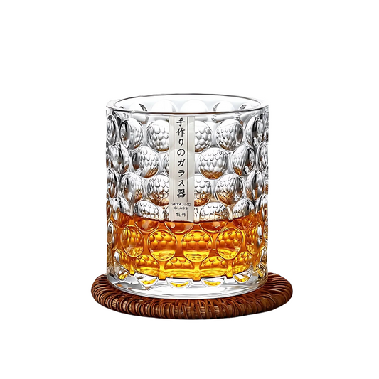 Elegant Japanese glassware - Kyoto Pour whiskey glass on a woven coaster